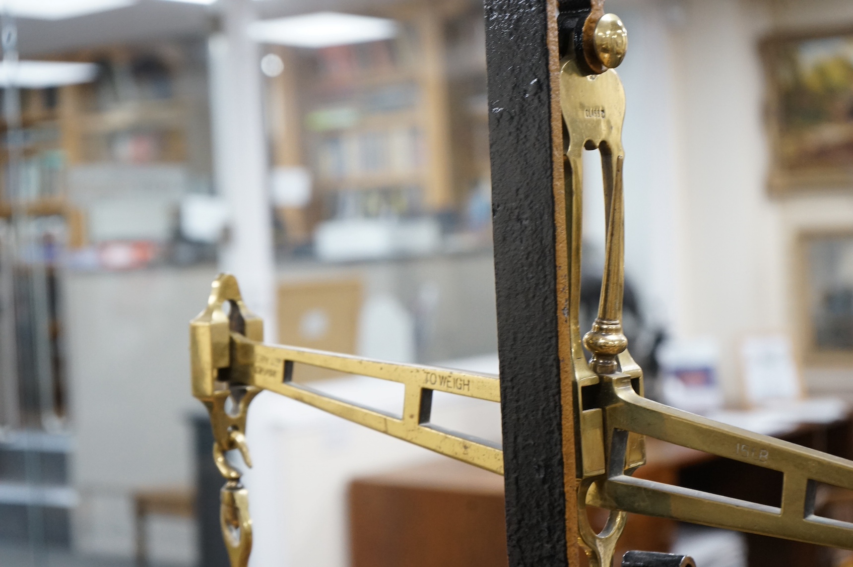 A brass Beam scale, on cast iron stand, W & T Avery, 95cm high. Condition - fair